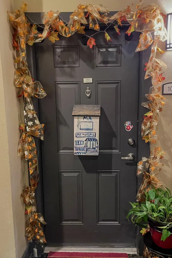 A resident's festively decorated hallway doorway in the fall decorating contest
