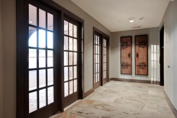 A sunlit entry hall with French doors