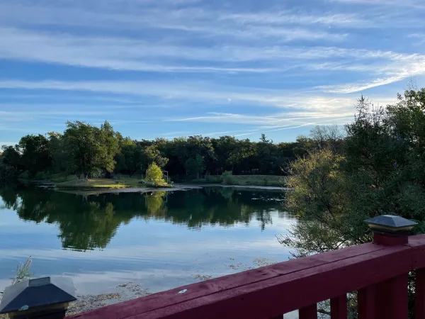 A calm view across Wildbriar Lake from the community fishing pier